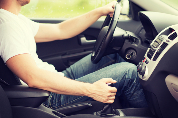 man holding gear knobs