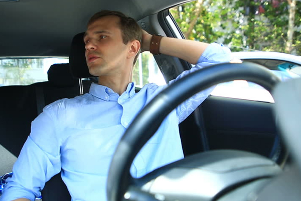 a man sitting in a car