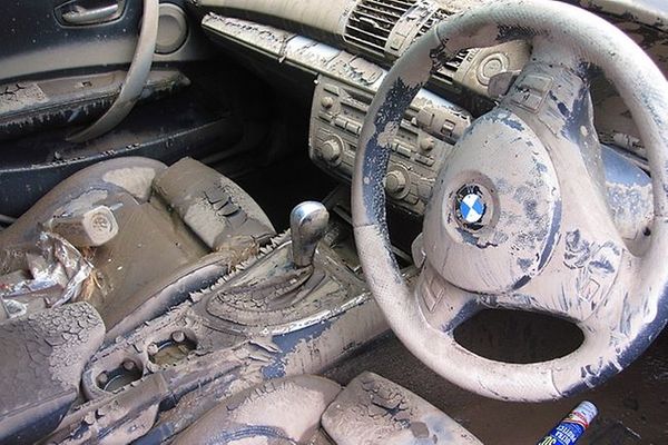 Car's interior full of mud and dirt