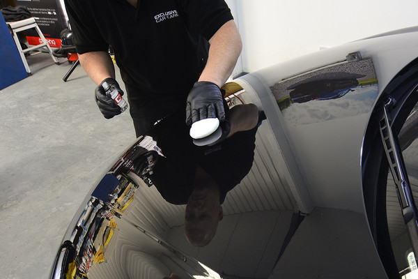 Man polishing a car