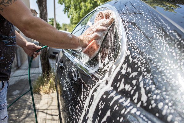 man washing the car