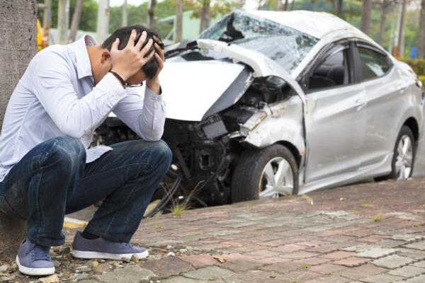 problematic man and crashed car