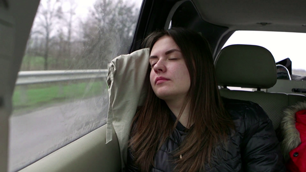 woman sleeping in car