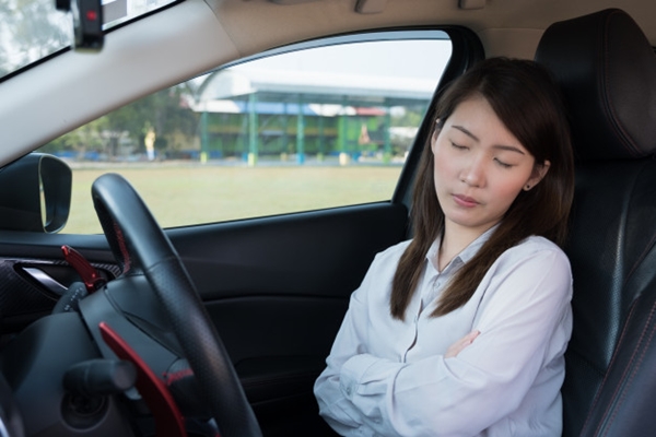 young woman sleeping car