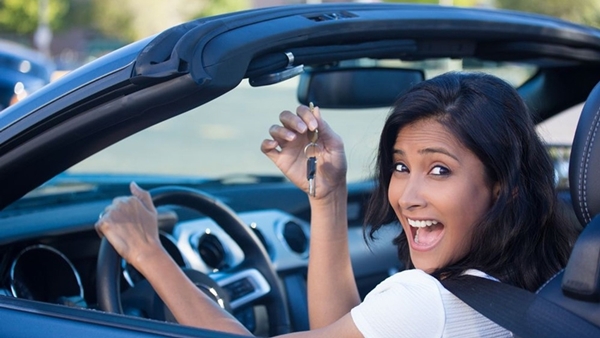 a lady driving a car